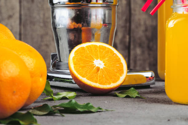 istock Orange juicer apparatus on kitchen table close up 1343507280