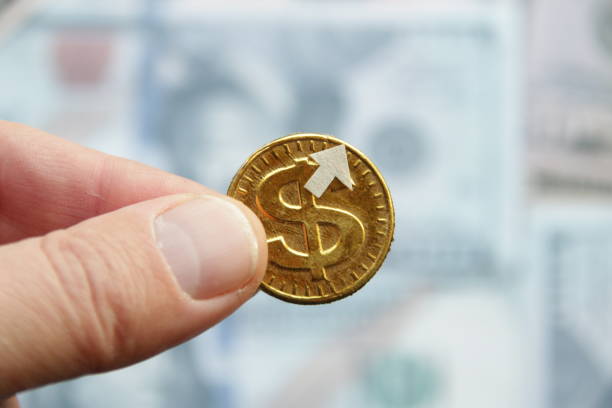 istock Gold Dolar with an up arrow. 1343509890