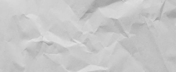 istock crumpled white color paper panoramic background texture for design concept 1343510168