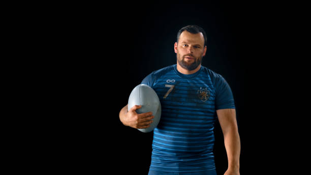 istock Close-up of rugby player standing with ball 1343513516