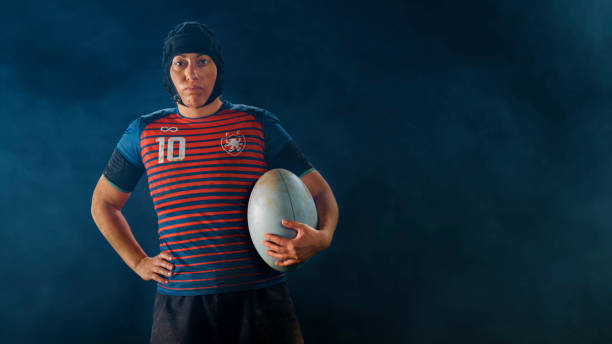 istock Close-up of rugby player standing with ball 1343513518