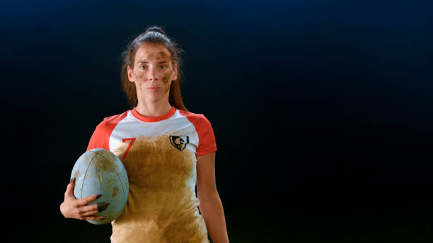 istock Close-up of rugby player standing with ball 1343513525
