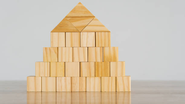 istock Wooden blocks isolated on white background with clipping path wood cube arrange in a pyramid shape, business concept 1343514038