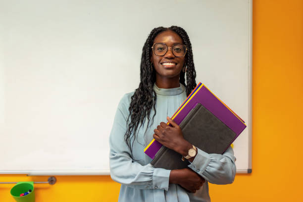 istock Black Female Teacher In The Classroom 1343514176