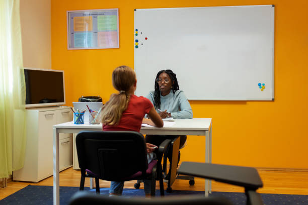 istock Girl Talks With Teacher In The Classroom 1343515330