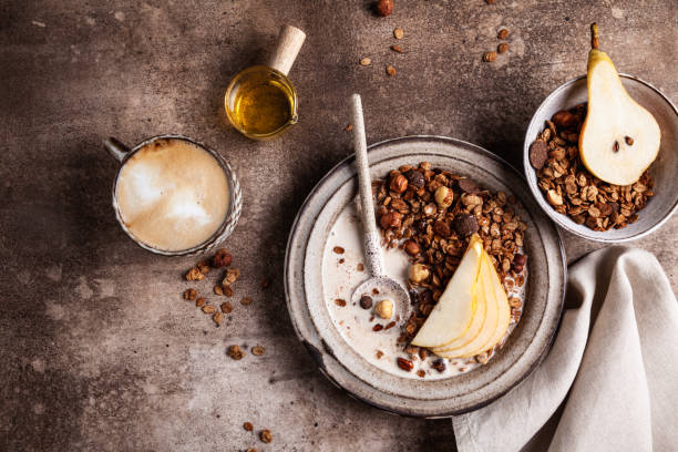 istock Chocolate granola with almond milk, pear and honey. 1343519033
