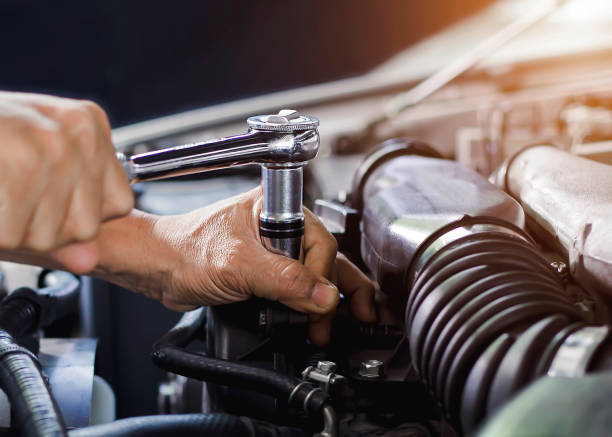 istock Car mechanic working on car engine, car maintenance concept. 1343519349