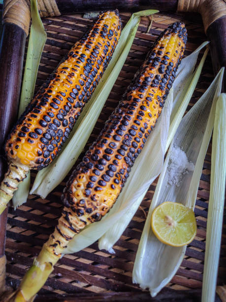 istock spicy sweet corn burn in fire with lemon and salt in a wood tray from different angles 1343520021