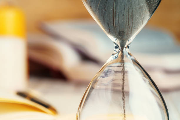 istock Sandglass clock close up on a table 1343521255