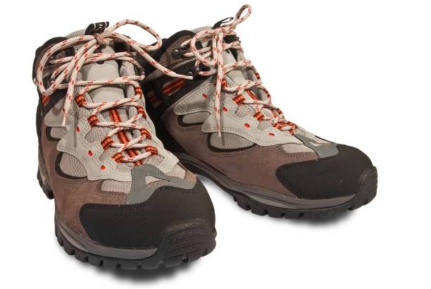 istock two closeup touristic boots on a white background 1343521577