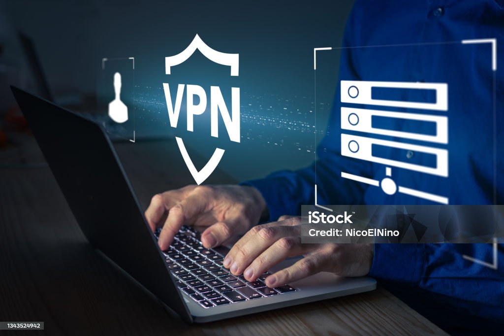 VPN secure connection concept. Person using Virtual Private Network technology on laptop computer to create encrypted tunnel to remote server on internet to protect data privacy or bypass censorship VPN Stock Photo