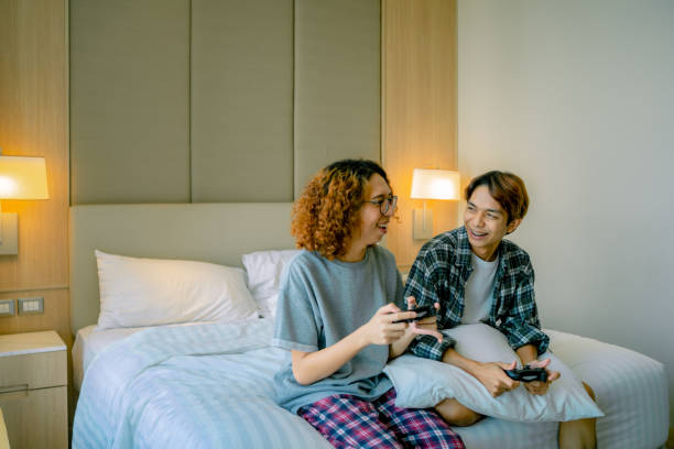 istock Couple having fun playing video games at home 1343525009