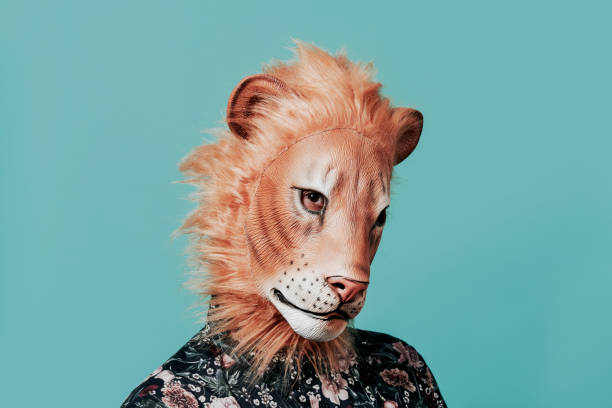 istock man wearing a lion mask 1343525380