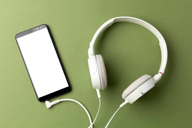 istock Smartphone with white screen and connected headphones. 1343526307
