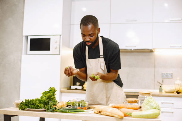 istock African-american man cooking in a kitchen 1343529198