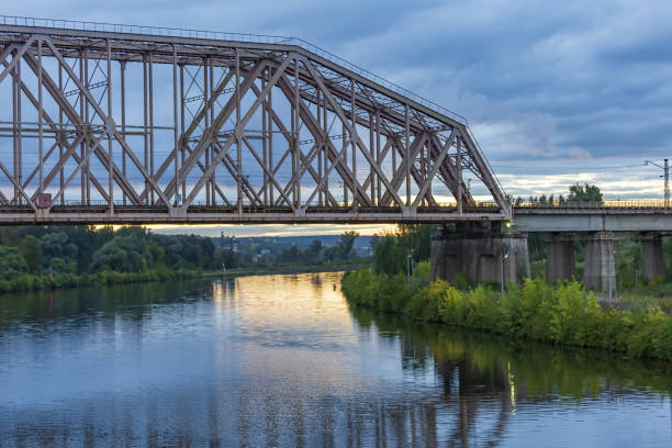 istock Iron transport bridge over the river during sunset 1343529754