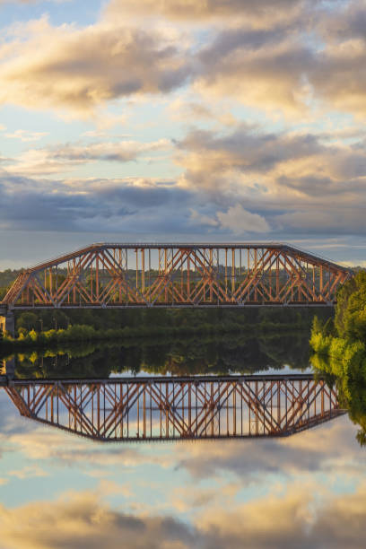 istock Iron transport bridge over the river during sunset 1343529756