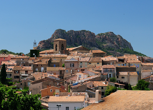 The Old Town Of Roquebrune D'Argens In Front Of A Giant Rock In France On A Beautiful Summer Day With A Clear Blue Sky
