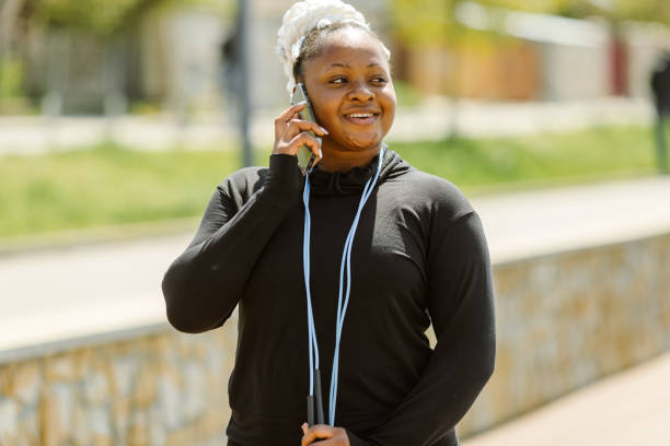 istock Afro-american plus size woman doing workout exercises session outdoor 1343531189