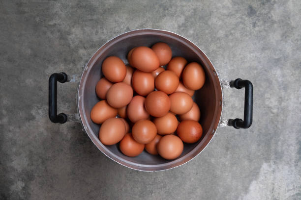 istock Chicken eggs in pot on rustic stone table background. Concept of homemade 1343533004