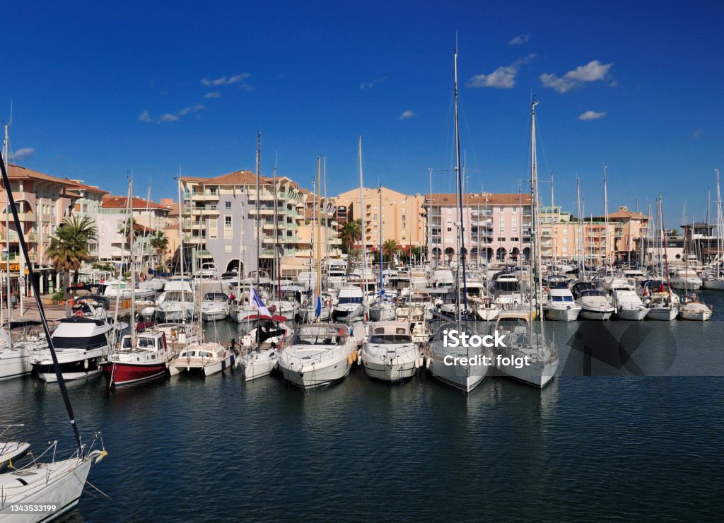 Luxurious Boats In The Yachting Harbour Of Frejus In France Luxurious Boats In The Yachting Harbour Of Frejus In France On A Beautiful Spring Day With A Clear Blue Sky Architecture Stock Photo