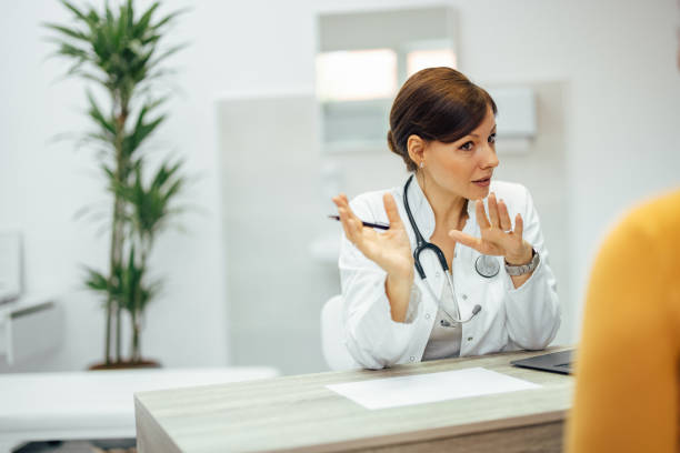 istock Doctor talking to a patient, gesturing. 1343539354