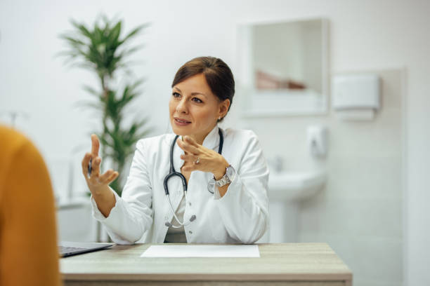 istock Doctor talking to a patient in private practice office. 1343539355