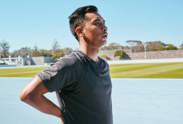 istock Shot of a man sweating while out training on track 1343540210