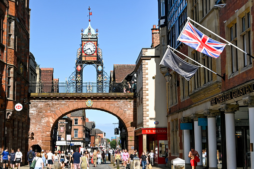 Chester, England - July 2021: Eastgate steet and Eastgate Clock in the city centre. The clock stands on the site of the original entrance to the Roman fortress of Deva Victrix