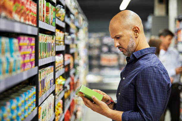 Shot of a man shopping for groceries in a supermarket stock photo