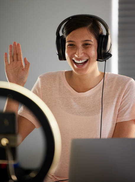 istock Shot of a young woman live streaming while working from home 1343545786