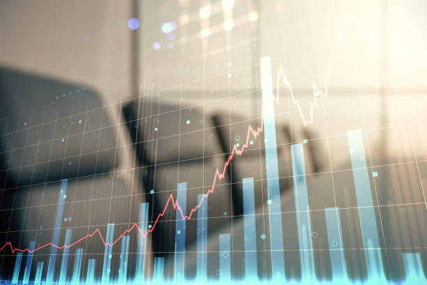 istock Multi exposure of virtual abstract financial graph interface on a modern coworking room background, financial and trading concept 1343547021
