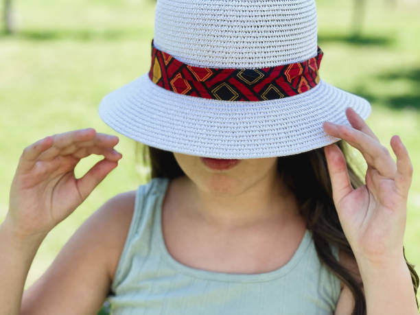 istock The girl and rhe hat 1343548725