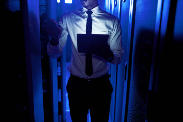 istock Closeup shot of an unrecognisable man using a digital tablet while working in a server room 1343553406
