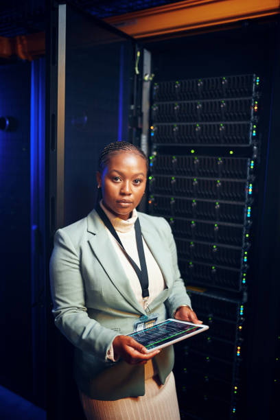 istock Portrait of a young woman using a digital tablet while working in a server room 1343553407