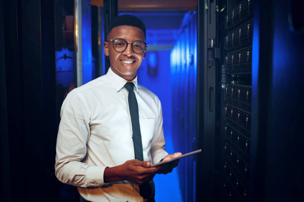 istock Portrait of a young man using a digital tablet while working in a server room 1343553411