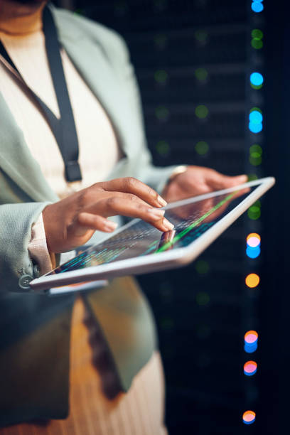 istock Closeup shot of an unrecognisable woman using a digital tablet while working in a server room 1343554115
