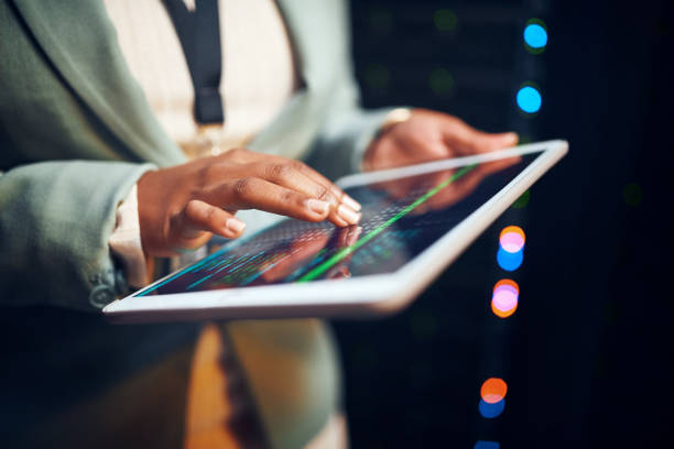 istock Closeup shot of an unrecognisable woman using a digital tablet while working in a server room 1343554116