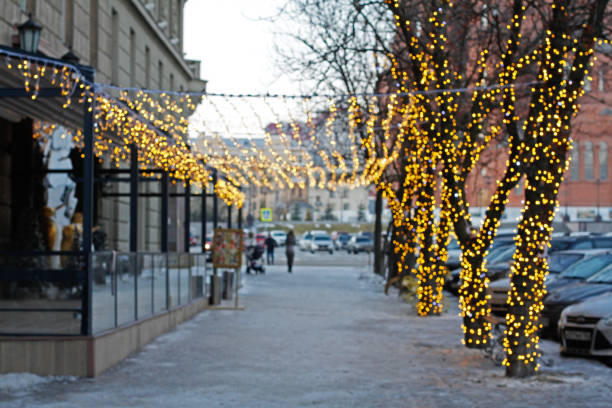 istock Abstract background of light trees and Illuminated ceiling with defocused lights in the city 1343557430