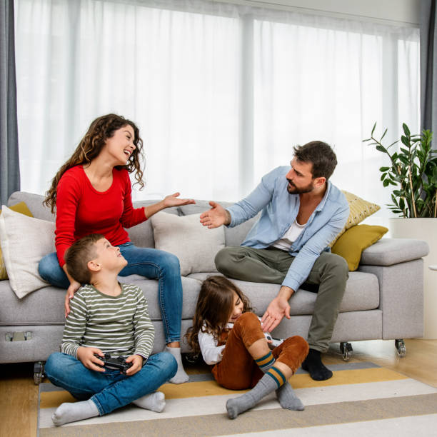 istock Family playing video games at home 1343563493