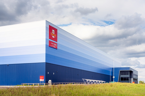 Milton Keynes, UK - The exterior of a large Royal Mail and Parcel Force depot, located close to the M1 Motorway.