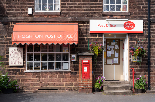 Hoghton, Lancashire, UK - The front entrance to a traditional Post Office in the small English village of Hoghton.