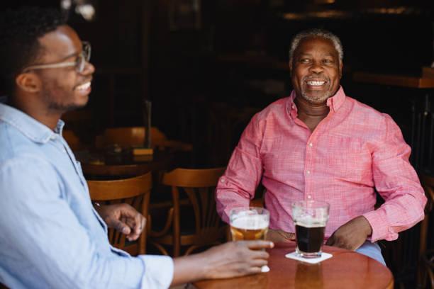 istock Father and son laugh as they spend time together 1343565753