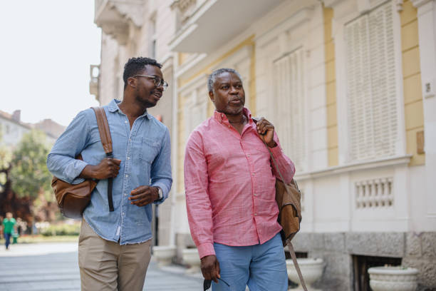 istock Father and son walking through the city 1343565921