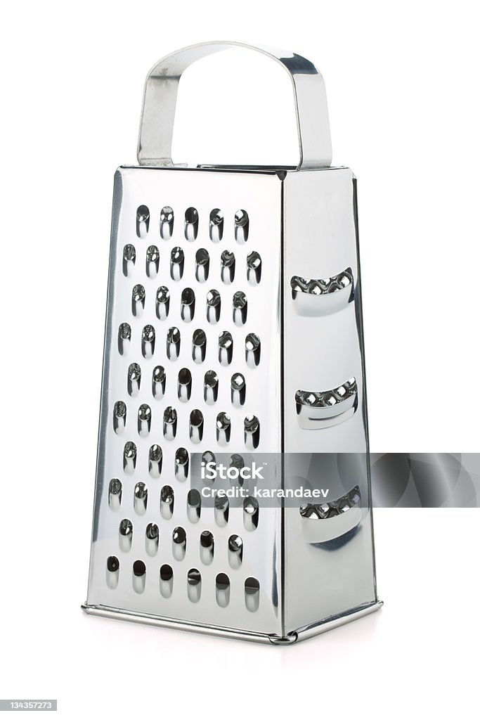 Metal grater with four different sides on white background Metal grater. Isolated on white background Cheese Grater Stock Photo