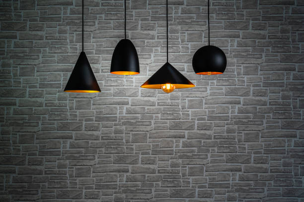 istock Pendant electric lamps and brick wall background 1343575206