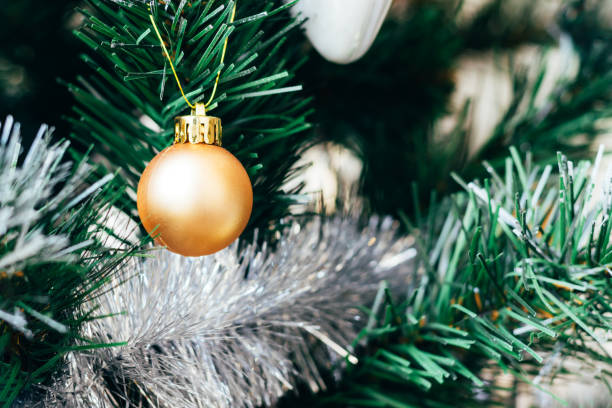 istock Golden ball on Christmas tree 1343575611