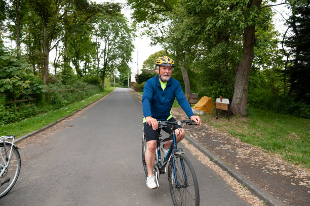 istock Active Senior Man Cycling Through a Village 1343576615
