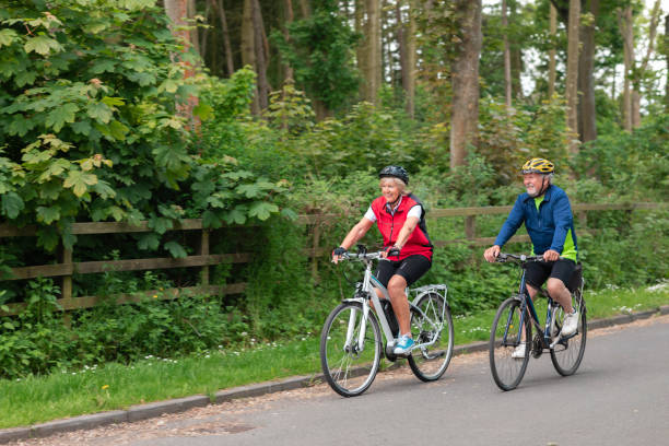 istock Couple Cycling Down a Country Road 1343576744