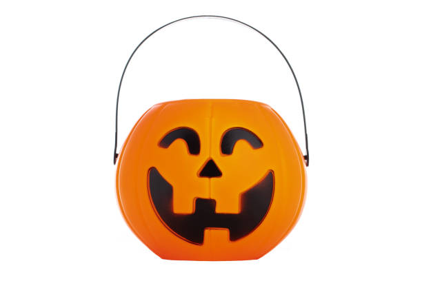 istock halloween pumpkin candy bowl isolated on a white background 1343576880